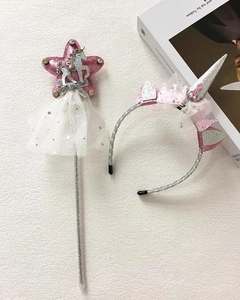 Detail of pink sequin star magic wand and unicorn headband for girls cosplay party