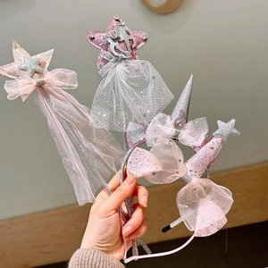 Detail of unicorn headbands and magic wands with glitter stars and tulle tassels