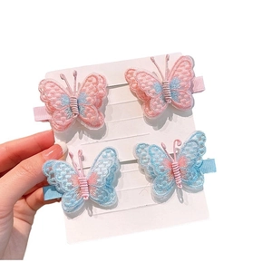 Set of four sweet embroidered butterfly hair clips with soft pastel colors and pearls