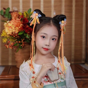 Close-up of Hanfu hair clips with orange flowers, pearls and long silk tassels