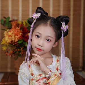 Detail showing lavender flower hair clips with long tassels and pearls for Hanfu dresses