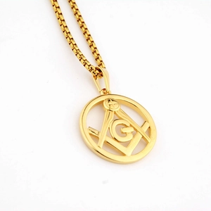 Detailed close-up of golden Freemasonry square and compass pendant with a sleek box chain