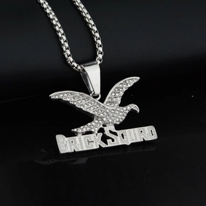 Eagle pendant with BRICK SQUAD letters and rhinestones on a box chain hip hop necklace