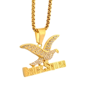 Iced out gold eagle pendant with Brick Squad lettering and sparkling rhinestones on box chain