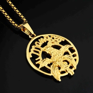 Polished gold eagle medallion pendant with box chain on a black reflective background
