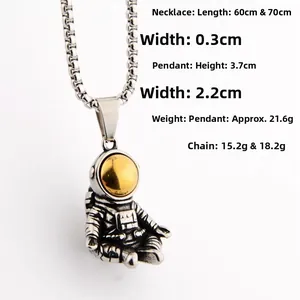 Close-up of astronaut pendant with golden visor and textured metallic spacesuit detail