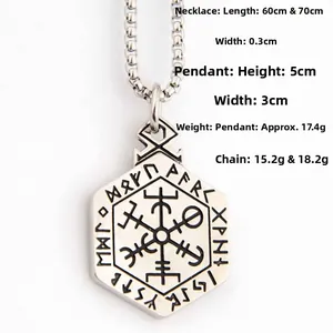 Macro shot of a Viking Vegvisir compass pendant with Nordic runes on silver stainless steel