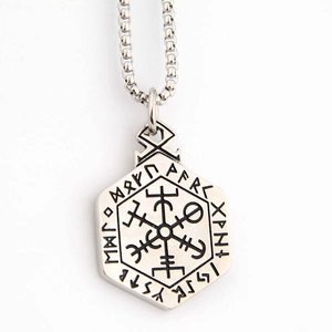 Close-up of hexagonal Viking Vegvisir compass pendant with Elder Futhark rune engravings