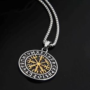 Macro shot of Viking Vegvisir pendant with gold-tone runes and stainless steel box chain