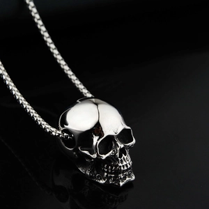 Polished silver skull pendant necklace with box chain for punk rock style enthusiasts