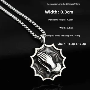 Detailed view of punk style praying hands pendant on a box chain with dimensions