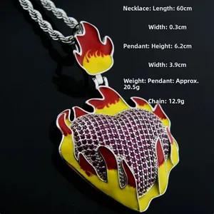 Macro shot of hip-hop flaming heart pendant with red and purple rhinestones