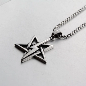 Detail of stainless steel star and lightning pendant with a durable box chain