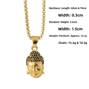 Detail shot of a gold Buddha head pendant with black rhinestones and box chain necklace