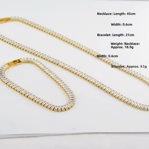 Macro shot of gold-plated hip hop chain with baguette-cut stones and sizing details