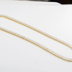 Detail of hip-hop titanium steel claw chain with gold finish and inlaid zircon crystals