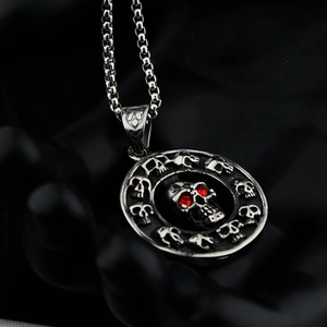 Gothic skull pendant necklace in silver with red rhinestone eyes and punk chain