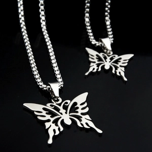 Unisex butterfly flame pendant necklaces set in silver stainless steel on black mirror