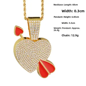 Detail of hip hop arrow heart pendant with full rhinestones on golden rope chain