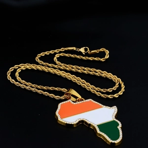 Detail of gold African map pendant with tricolor flag enamel and sparkling rhinestones
