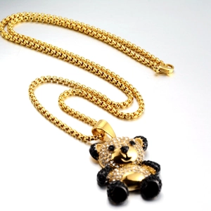 Macro view of hip hop panda pendant with white rhinestones and black crystal accents