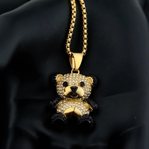 Detail of panda pendant with micro-pave black and white rhinestones on golden chain