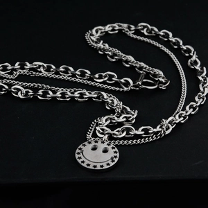 Double layered silver titanium steel necklace with hollow smiley face and star pendant