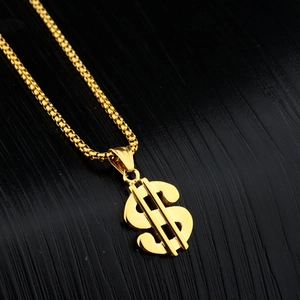 Gouden dollarteken hanger ketting met box ketting op een premium zwarte textuur achtergrond