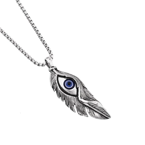 Detailed close-up of a silver feather pendant with a blue evil eye on a long square chain
