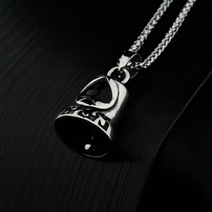 Vintage stainless steel biker bell pendant with spade motif on a woven chain necklace