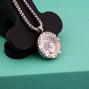 Silver tree of life locket necklace engraved with I love you to the moon and back