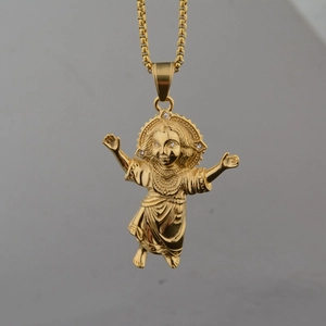 Macro view of gold angel pendant with zircon detailing and box chain necklace