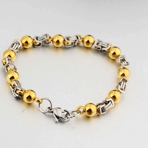 Bracciale bizantino in acciaio al titanio con maglie argento e sfere dorate da 8mm