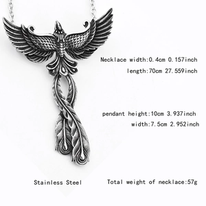 Detailed macro of the vintage stainless steel phoenix pendant with fine feather textures