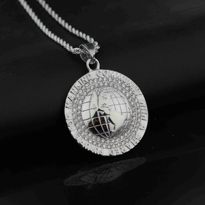 Silver Earth globe pendant necklace with white crystals and engraved community phrase