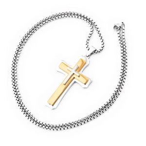 Macro view of three-layer cross pendant with gold and silver polished metal finish