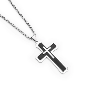 Macro detail of triple layer silver cross pendant with black inlay on box chain