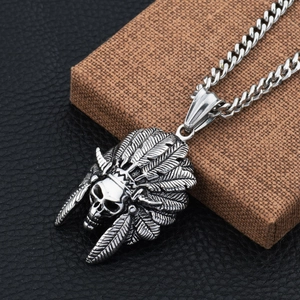 Macro shot of Indian skull pendant with feather headdress on heavy duty Cuban chain