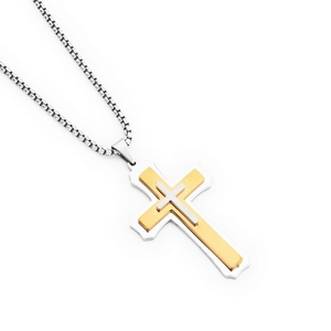 Detail of a three-layer cross pendant in gold and silver tones with a sleek box chain