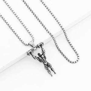 Detailed macro view of retro silver barbell man pendant with brushed steel texture