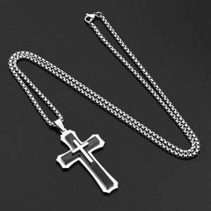 Close-up of triple-layered cross pendant with black inlay and polished steel box chain