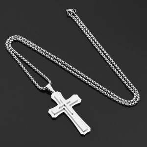 Detailed close-up of triple-layered silver cross pendant on a classic round box chain