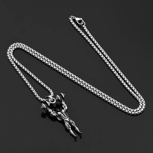 Macro view of silver barbell man pendant with muscular texture and durable box chain link