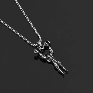 Detailed view of silver muscular bodybuilder pendant with barbell on box chain