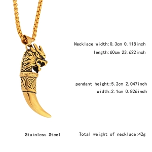 Detailed view of golden dragon wolf tooth pendant with 60cm stainless steel box chain