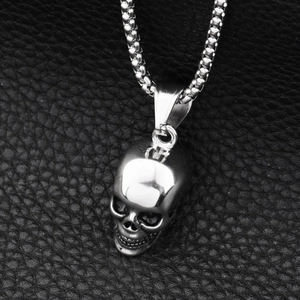 Gothic 3D skull pendant necklace in silver stainless steel on black leather background