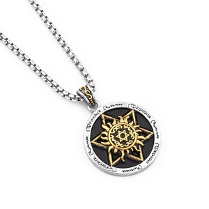 Macro detail of tricolor sun hexagram pendant with silver square link chain