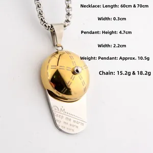 Detail of hip hop baseball cap pendant with Keep Me Warm engraving and box chain