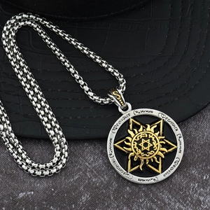 Macro detail of hexagram pendant necklace with sun totem and vintage metallic finish