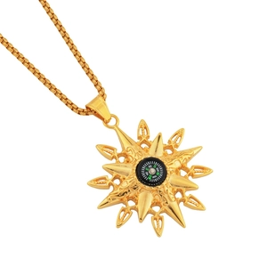Gold compass pendant necklace with sunburst engraving on a classic box chain